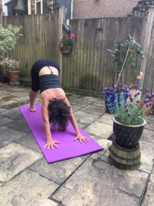 downward dog pose in the back garden