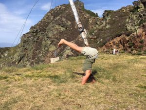 headstand in the mountains