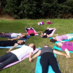 people doing yoga in a circle