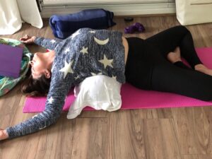 woman doing a relaxing yoga backbend